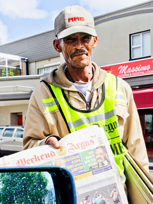 Street vendor selling the newspaper