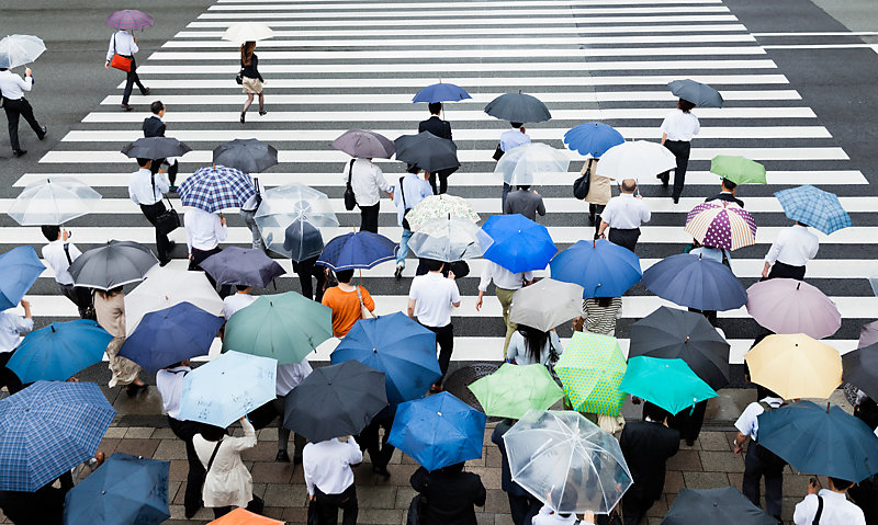 Crosswalk scene on a rainy day in Tokyo, Japan.