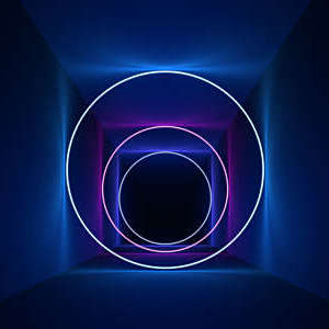 Digitally generated ring-shaped neon lights give a depth effect to a flat surface.