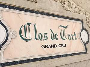 Marble name plate on a building at the "Clos du Tart" wine estate in Burgundy, France.