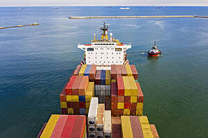 Aerial view of freight ship with cargo containers.