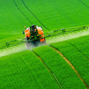 Tractor spraying chemicals